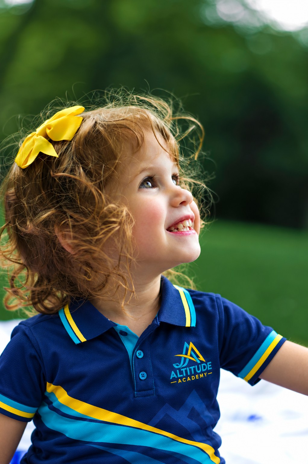 A smiling child wearing the school uniform